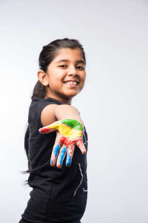 Cute Little Girl Showing Painted Hand or Colourful Palmの写真素材
