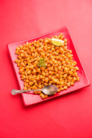 Crispy Fried Corn is a Chatpata starter snack from India, served in a bowl, selective focusの写真素材