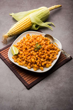 Crispy Fried Corn is a Chatpata starter snack from India, served in a bowl, selective focusの写真素材