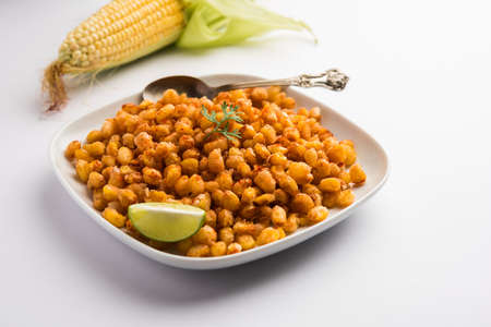 Crispy Fried Corn is a Chatpata starter snack from India, served in a bowl, selective focusの写真素材