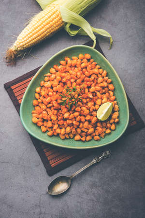 Crispy Fried Corn is a Chatpata starter snack from India, served in a bowl, selective focusの写真素材