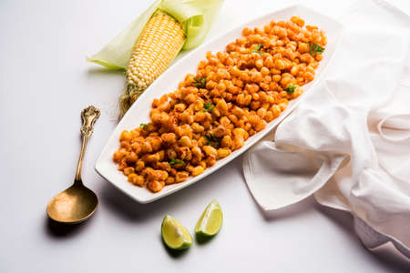 Crispy Fried Corn is a Chatpata starter snack from India, served in a bowl, selective focusの写真素材