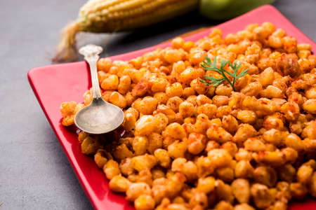 Crispy Fried Corn is a Chatpata starter snack from India, served in a bowl, selective focusの写真素材
