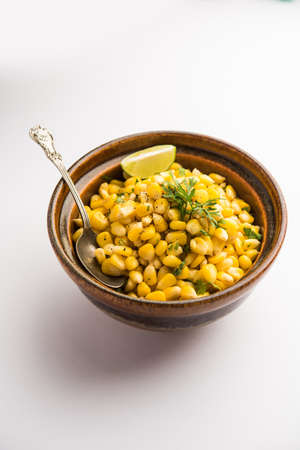 Spicy Masala Sweet Corn isolated on white