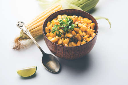 Spicy Masala Sweet Corn is a tasty roadside Indian snack, which is very easy to make. selective focusの写真素材