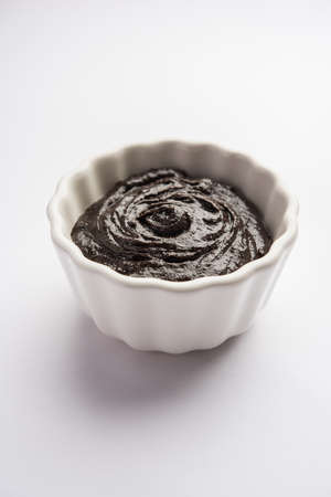 Chyawanprash or Chyavanprash is an Indian Ayurvedic Immunity booster health supplement made up of a concentrated blend of minerals and nutrient-rich herbs, served in a bowl, isolatedの写真素材
