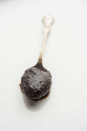 Chyawanprash or Chyavanprash is an Indian Ayurvedic Immunity booster health supplement made up of a concentrated blend of minerals and nutrient-rich herbs, served in a bowl, isolatedの写真素材