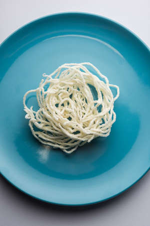 Kurdai or Kurdayi or Kurdayee is a fried dish made using wheat / gehu. selective focus