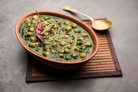 chickpea Spinach Curry or Chana Masala with Palak served with Rice and flatbread or Paratha, selective focusの写真素材
