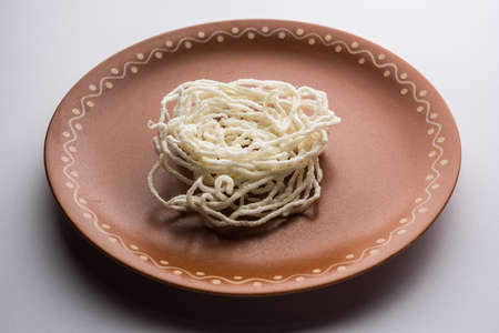 Kurdai or Kurdayi or Kurdayee is a fried dish made using wheat / gehu. selective focus