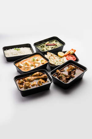 Online Food delivery concept Indian paneer butter masala and palak paneer, mutton & chicken curry...
