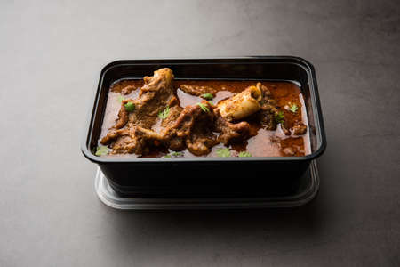 Online Food Delivery - Mutton OR Gosht Masala OR indian lamb rogan josh in a plastic containar ready...