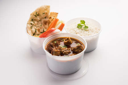 Online Food Delivery - Mutton OR Gosht Masala OR indian lamb rogan josh in a plastic containar ready for pickupの写真素材