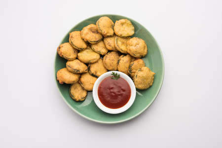 Sponge gourd fritters or gilki bhaji or bajjiÂ orÂ pakora is an Indian snack item, served with...
