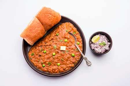 Mumbai Style Pav bhaji is a fast food dish from India, consists of a thick vegetable curry served...