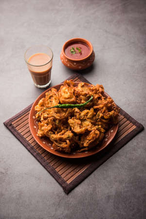 Fried onion pakora or Pyaj Pakoda also known as Crispy Kanda bhaji /Bhajji / bajji, favourite Indian...