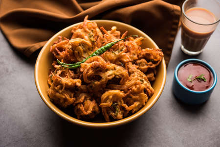 Fried onion pakora or Pyaj Pakoda also known as Crispy Kanda bhaji /Bhajji / bajji, favourite Indian...