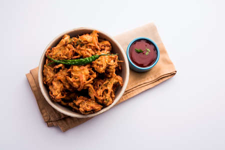Fried onion pakora or Pyaj Pakoda also known as Crispy Kanda bhaji /Bhajji / bajji, favourite Indian...