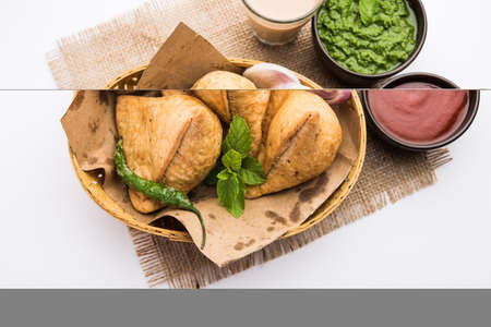 Samosa - Triangle shape fried / baked pastry with savoury filling, popular Indian Tea Time snacks,...