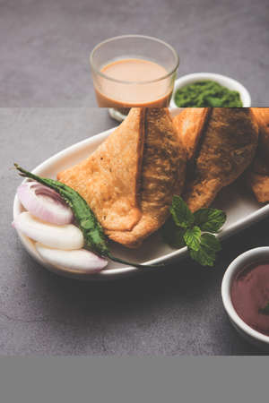 Samosa - Triangle shape fried / baked pastry with savoury filling, popular Indian Tea Time snacks,...