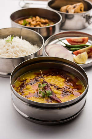 Indian vegetarian Lunch Box or Tiffin made up of stainless steel for office or workplace, includes...