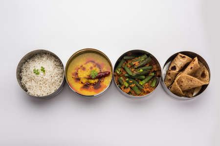 Indian vegetarian Lunch Box or Tiffin made up of stainless steel for office or workplace, includes...