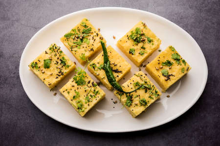 Gujarati Khaman Dhokla made using Chana Dal, served with Green chutney, selective focus