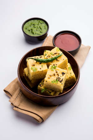 Gujarati Khaman Dhokla made using Chana Dal, served with Green chutney, selective focusの写真素材