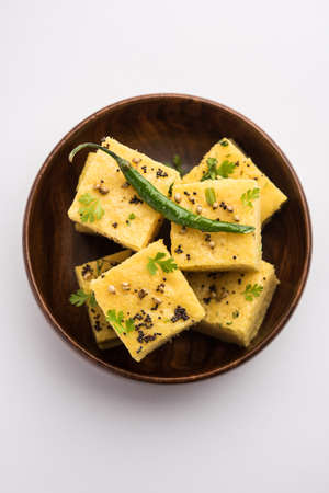 Gujarati Khaman Dhokla made using Chana Dal, served with Green chutney, selective focusの写真素材