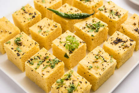 Gujarati Khaman Dhokla made using Chana Dal, served with Green chutney, selective focus