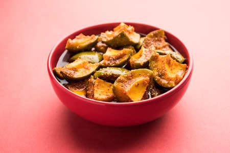 Homemade Mango Pickle or Aam ka Achar in a bowl, selective focus