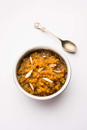 Moong dal halwa is a classic Indian sweet dish made with moong lentils, sugar, ghee and cardamom powderの写真素材