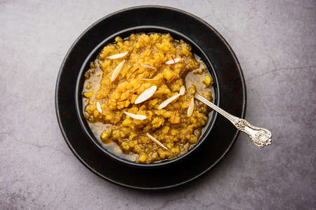 Moong dal halwa is a classic Indian sweet dish made with moong lentils, sugar, ghee and cardamom powderの写真素材