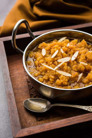 Moong dal halwa is a classic Indian sweet dish made with moong lentils, sugar, ghee and cardamom powderの写真素材