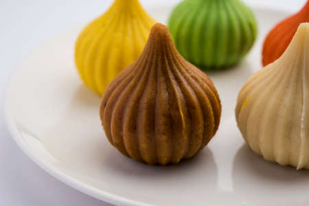 Modak is an Indian sweet dumpling offered to Lord Ganapati on Ganesh Chaturthi Festival. Served in a plate. Selective focusの写真素材