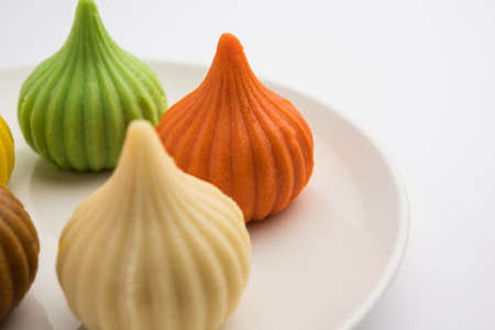 Modak is an Indian sweet dumpling offered to Lord Ganapati on Ganesh Chaturthi Festival. Served in a plate. Selective focusの写真素材