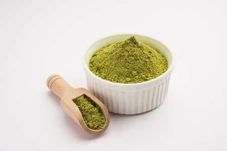 Herbal henna or Mehandi powder in a bowl forming heap, Used for Tattoo or Hair Dye in India