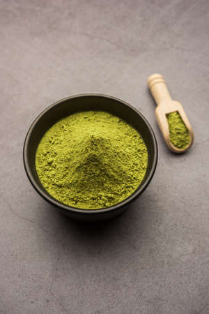 Herbal henna or Mehandi powder in a bowl forming heap, Used for Tattoo or Hair Dye in Indiaの写真素材