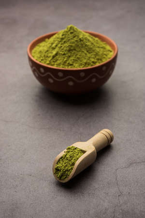 Herbal henna or Mehandi powder in a bowl forming heap, Used for Tattoo or Hair Dye in Indiaの写真素材