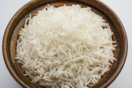 Long Basmati Rice in cooked form is an Indian main course food, served in a bowl. selective focus