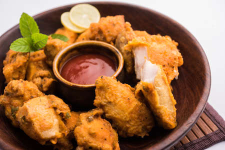 Chicken Pakora or pakoda or fritters is a popular Indian snack in which boneless chicken pieces are marinated and then coated with a mixture of besan, rice flour, cornflour, and eggの写真素材