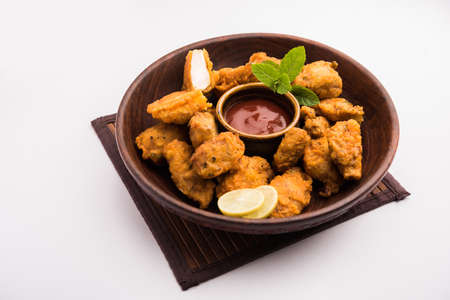 Chicken Pakora or pakoda or fritters is a popular Indian snack in which boneless chicken pieces are marinated and then coated with a mixture of besan, rice flour, cornflour, and eggの写真素材