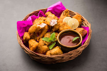 Chicken Pakora or pakoda or fritters is a popular Indian snack in which boneless chicken pieces are marinated and then coated with a mixture of besan, rice flour, cornflour, and eggの写真素材