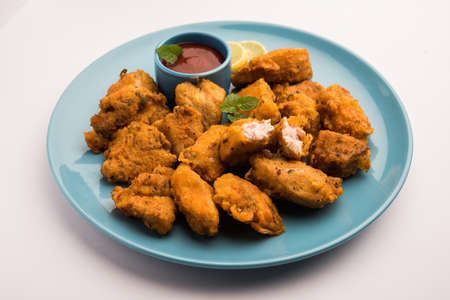 Chicken Pakora or pakoda or fritters is a popular Indian snack in which boneless chicken pieces are marinated and then coated with a mixture of besan, rice flour, cornflour, and eggの写真素材