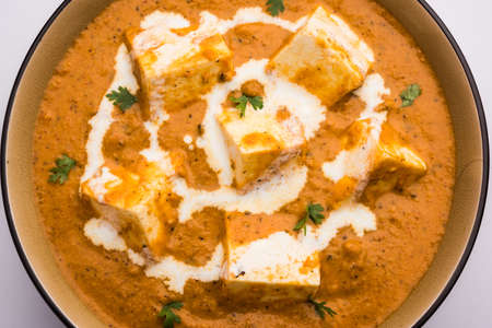 Paneer Butter Masala or Cheese Cottage Curry, popular Indian Lunch/Dinner menu Â served in a ceramic bowl, selective focusの写真素材