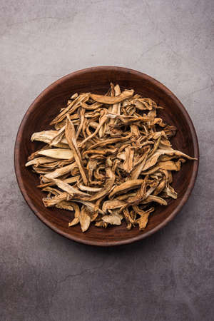 Sun-dried unripe green mango or kairi fruit is an indian dried spice used in Indian curries