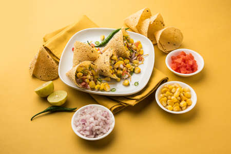 Corn chat / chaat in papad cone, popular indian starter menu