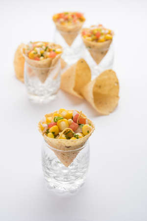 Corn chat / chaat in papad cone, popular indian starter menu