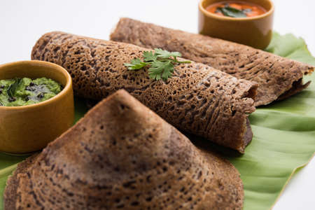 Finger Millet orÂ Ragi DosaÂ is a healthy Indian breakfast served with chutney, in roll, flat or cone shapeの写真素材