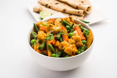 Mix Vegetable dry recipe in a bowl, Indian restaurant style veg recipe served with Chapatiの写真素材